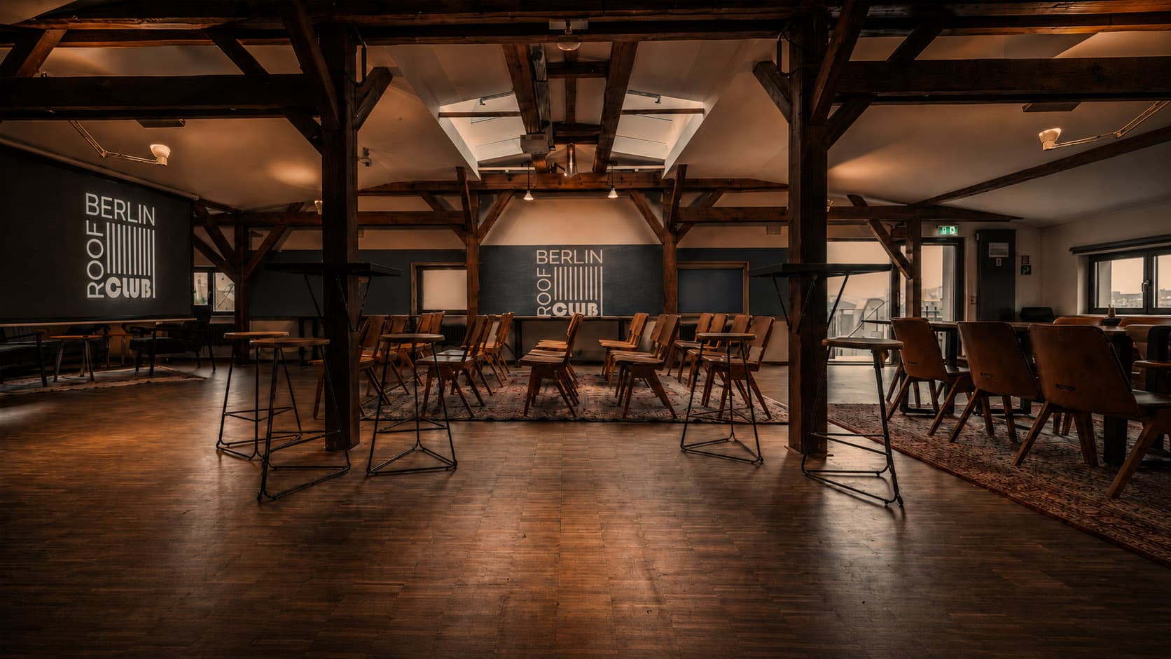 Interior with wooden beams and seating for meetings and workshops