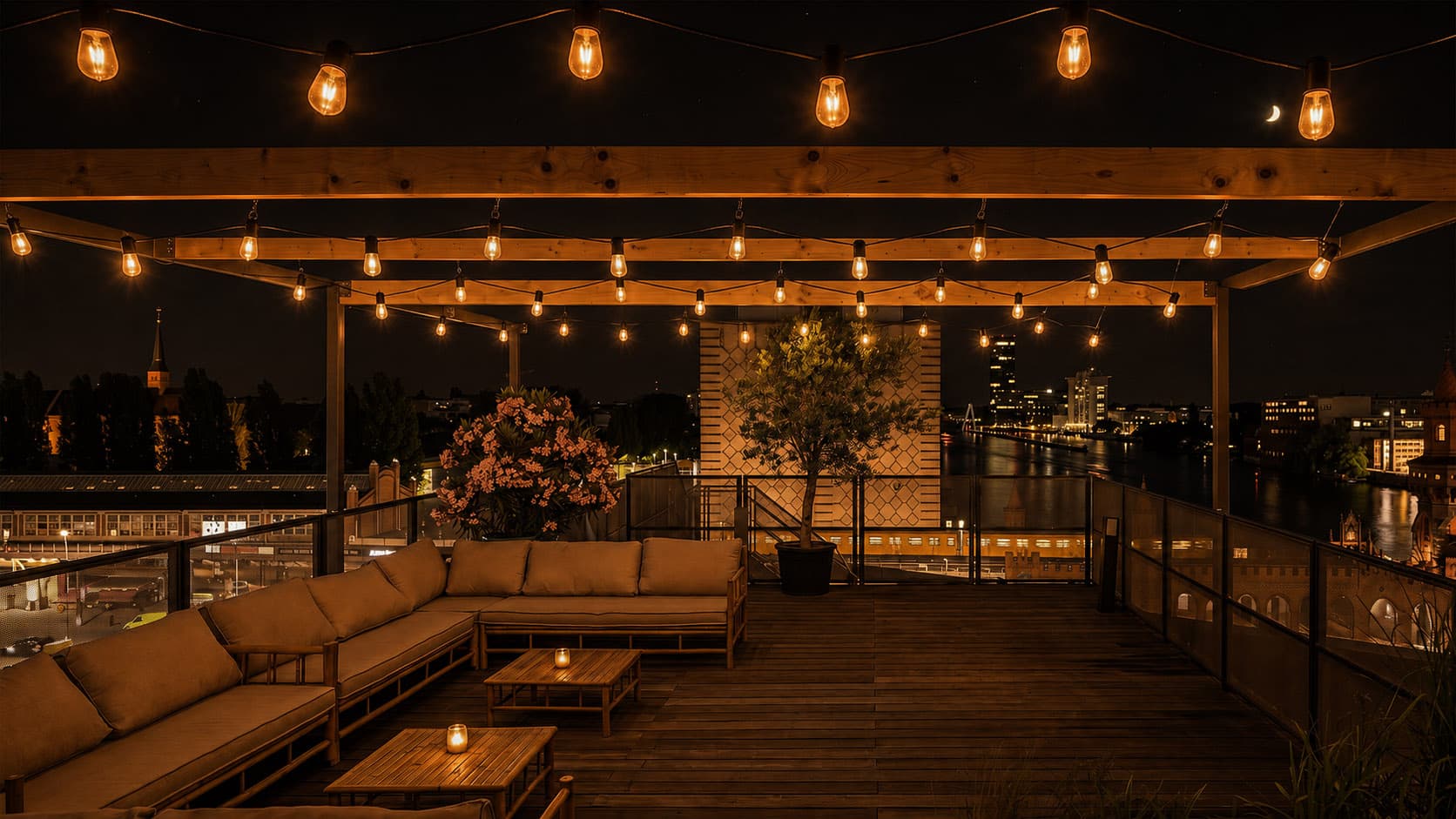 Lounge terrace at night with fairy lights and skyline
